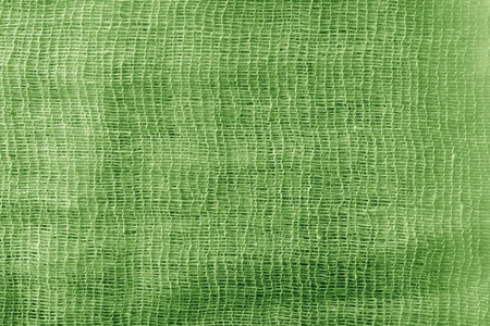 the bright abstract color texture of a gauze is painted in  green colorの写真素材