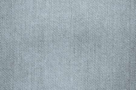 the abstract painted texture of denim for a background of silvery colorの写真素材