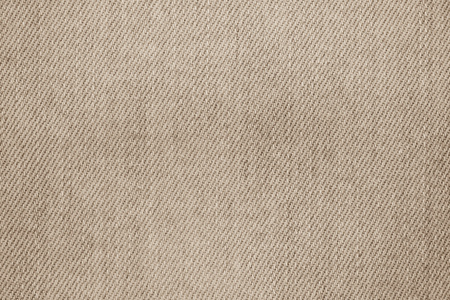 the abstract painted texture of denim for a background of brown colorの写真素材
