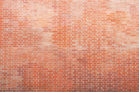 textured background of a brick wall from a natural red brick for abstract backgrounds