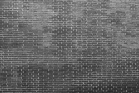 texture of an old bricklaying in dark black tones for abstract backgrounds and for wallpaperの写真素材