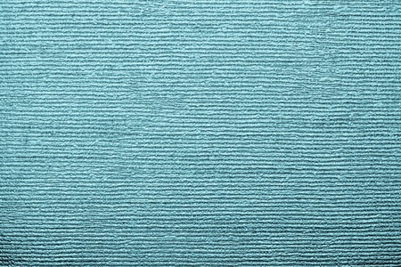 horizontal corrugated texture of paper wallpaper with an imprinted vinyl surface for abstract backgrounds of indigo colorの写真素材