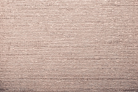 horizontal corrugated texture of paper wallpaper with an imprinted vinyl surface for abstract backgrounds of brown terracotta colorの写真素材