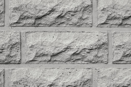 the rough textured concrete wall closeup for abstract backgrounds of gray color