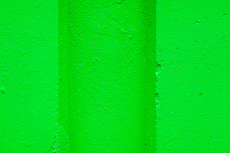 abstract relief of a hollow and ledges on a concrete wall for textural backgrounds of bright green colorの写真素材