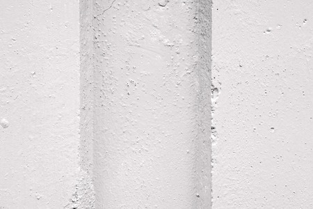 abstract relief of a hollow and ledges on a concrete wall for textural backgrounds of gray colorの写真素材