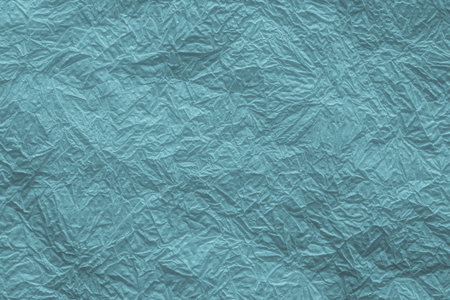 abstract texture of the crumpled thin paper napkin for backgrounds of indigo color