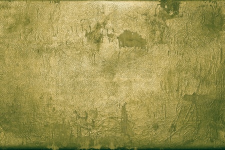 the abstract textured background of rough shabby and frayed old leather of dark bronze color with glossの写真素材
