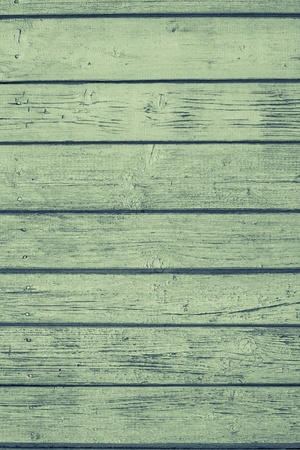 the old painted wooden boards with cracks for the abstract textured backgrounds of green colorの写真素材