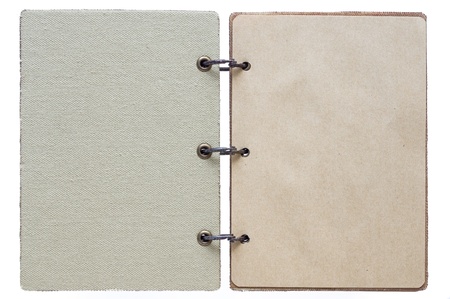 open notebook on a white background with a textile cover and with paper pagesの写真素材