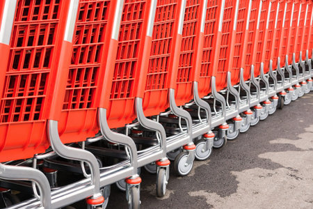 abstract parts of red baskets-carts for warehousing of food and household goods upon purchase in...