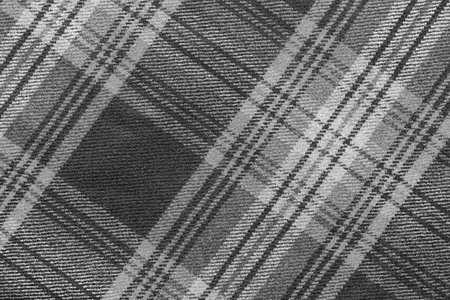 monochrome texture of woolen fabric with an slanting checkered pattern for backgrounds and for wallpaperの写真素材