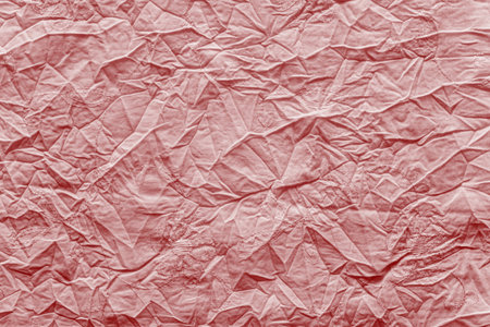 abstract crumpled texture of linen fabric of bright red color with gentle an embroidery of flowers...
