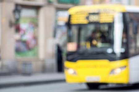 the abstract unsharp digital photo of the image of bus on city streets for indistinct empty and pure backgroundsの写真素材
