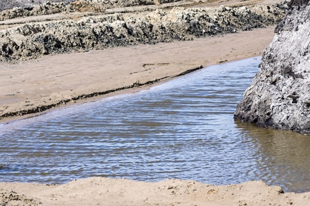 sand quarry for road construction it is filled with partially rain and underground ground watersの写真素材