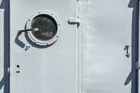 abstract part of a door with a window on board the old ship and a blank space for the textの写真素材