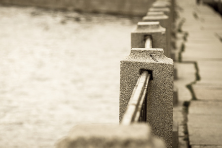 old architectural protection from a stone and metal for the embankment and a blank space for the textの写真素材