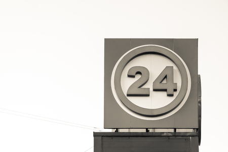big sign with number 24 against a clear sky and a blank space for the textの写真素材