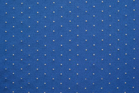 thin texture of knitted fabric of blue color with small blond specks for abstract backgroundsの写真素材