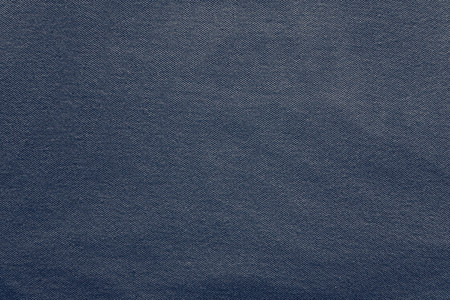 texture of knitted fabric of dark violet color with a blank space for pure backgroundsの写真素材