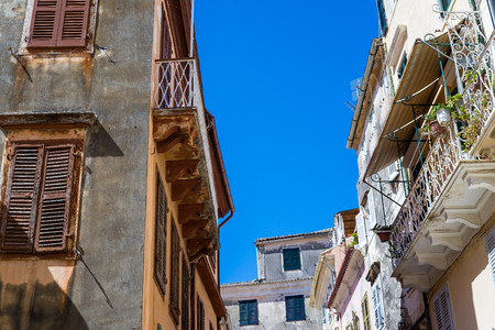 fragment of the old european street of lane or quarter  with vintage facades of houses closeupの写真素材