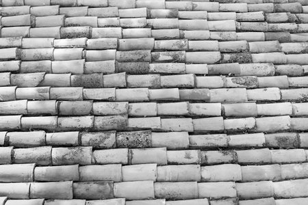 wavy corrugated texture of a tile roof for the abstract vintage textured backgrounds of monochrome...