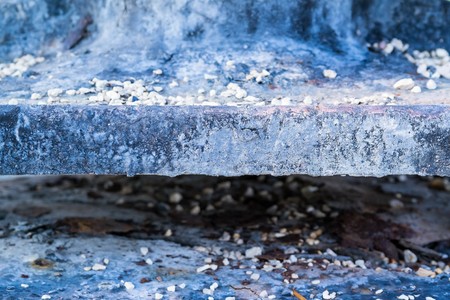 old abstract texture of an edge or end face of the charred plate against indistinct and not sharpの写真素材