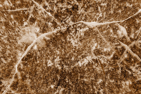 transparent texture of natural ice of brown color for an abstract backgroundの写真素材