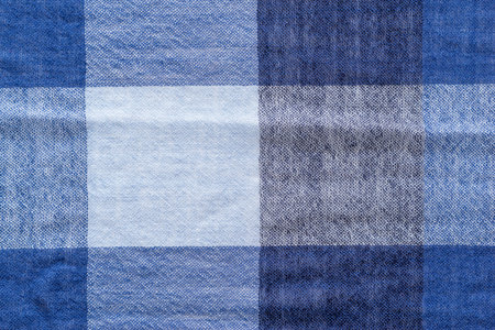 texture of soft woolen checkered fabric of blue tone for an abstract design background