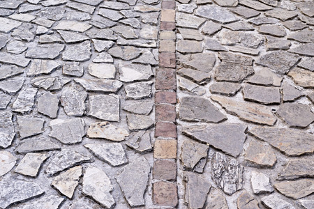 abstract texture of an old stone pavement or the sidewalk for a vintage backgroundの写真素材