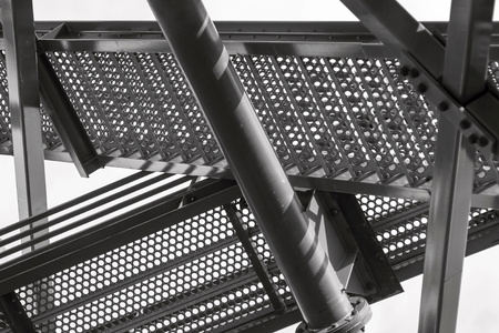metal design or structure of a construction of black steel color for an abstract industrial backgroundの写真素材