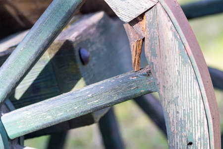 fragment of a big wooden wheel with spokes for an ancient cartage and for the cart or the vehicleの写真素材