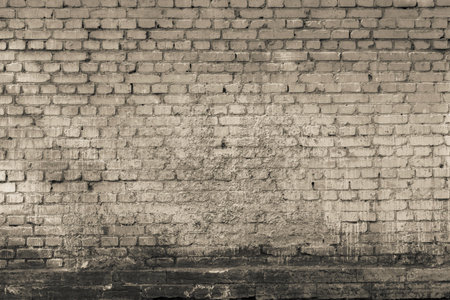 the brick textured background or wallpaper of abstract monochrome tone of beige colorの写真素材