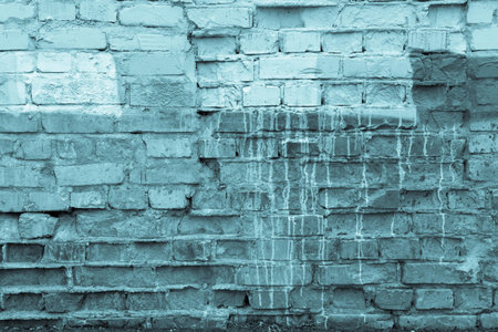 the blue textured background of an old dirty brick wallの写真素材
