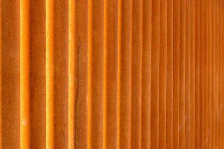 indistinct texture of rusty iron pipes of red color for a backgroundの写真素材