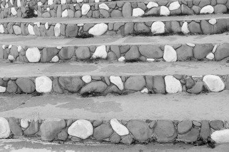 stone steps closeup with a spotty striped pattern of gray color for the abstract background or for...
