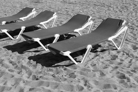 sunbed closeup of monochrome tone on the beach or on the sandy coast and a blank spaceの写真素材