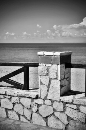 architecture of the stone embankment or seafront with a fence closeup of monochrome tone in retro styleの写真素材