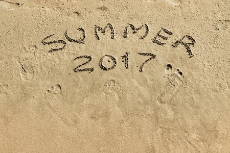 summer of 2017 an inscription closeup on sand of the sea coastの写真素材