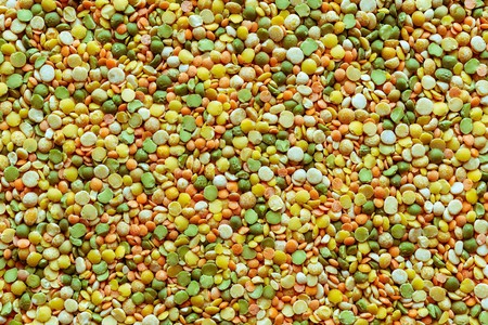 background and texture of dried shredded peas of different motley colorの写真素材