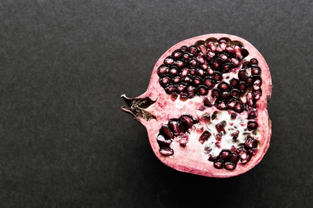 longitudinal cut or section of one garnet as the isolated object closeup on black backgroundの写真素材
