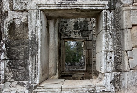 Cambodia a part of a wall historical the building or the temple with ancient window closeupの写真素材