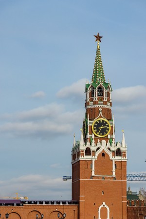 Spasskaya Tower of the Russian Kremlin closeup against the background of the skyの写真素材