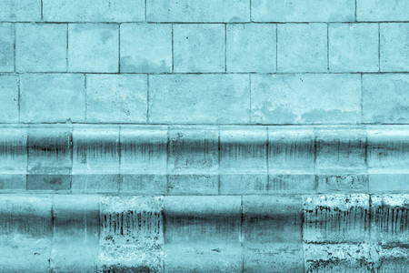 vintage background and old texture of an ancient stone wallの写真素材