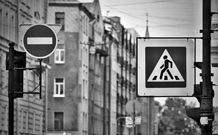 the street sign or the road sign the crosswalk and the movement it is forbidden on the city street in the photo with effect monochrome tone.の写真素材