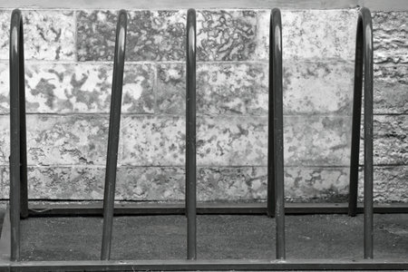 the free parking for bicycles from metal closeup of monochrome tone