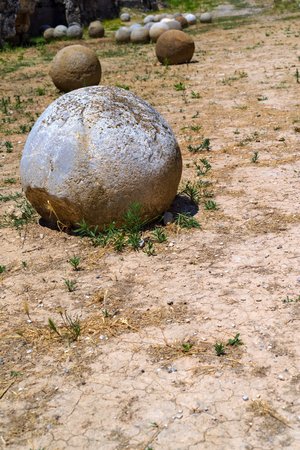 one big round stone or stone kernel is located separately on the dry soilの写真素材