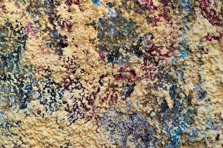 the rough granular and motley textured stone surface for an abstract background or for wallpaperの写真素材