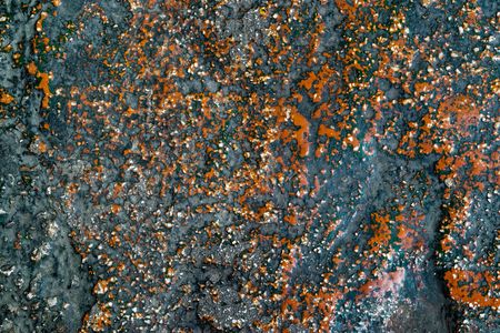 the rough granular and motley textured stone surface for an abstract background or for wallpaperの写真素材