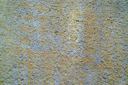 the rough grained textured stone surface for an abstract background or for wallpaperの写真素材